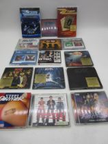 A small collection of CDs including AC/DC, ZZ Top, Steel Panther etc along with two ZZ Top DVDs