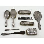 A collection of hallmarked silver dressing table brushes, mirror etc.