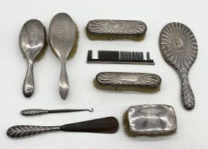 A collection of hallmarked silver dressing table brushes, mirror etc.