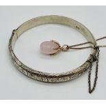 A hallmarked silver hinged bracelet along with a silver gilt pendant on chain