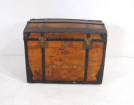 An antique metal bound dome topped trunk, with stud detailing and brass plaque with initials 'E M' -