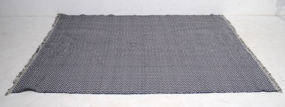 A 'Fasterholt' blue and white rug - 170cm x 240cm