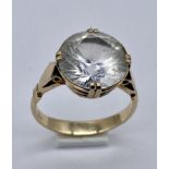 A 9ct gold ring set with a large white sapphire (stone 1.2cm approx. diameter)