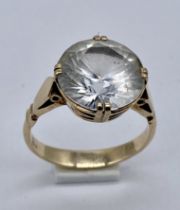 A 9ct gold ring set with a large white sapphire (stone 1.2cm approx. diameter)