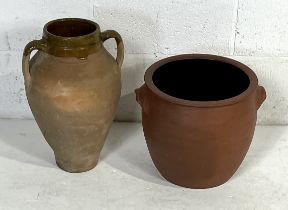 A terracotta crock pot by C.H. Brannam Ltd (small chip to handle and lid) plus a part glazed urn (