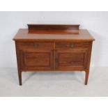 An Edwardian inlaid mahogany washstand, raised on tapered legs - length 108cm, depth 51cm, height