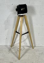 An industrial Rank Strand Minim F lamp on tripod legs. Height 97cm