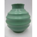 A Wedgwood Pottery vase designed by Keith Murray, ribbed, ovoid form, covered in a matt green glaze,
