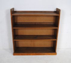 An oak freestanding bookcase - length 104cm, depth 30cm, height 110.5cm