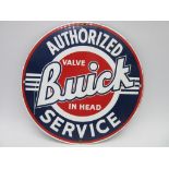 A reproduction enamelled sign 'Buick Authorised Service', diameter 28.5cm