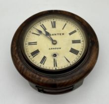 A small Victorian railway style wall hanging clock. Clock face is marked T. Ganter, London.