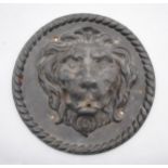 A lead fountain head in the form of a lions head - diameter 30cm