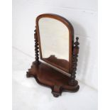 A Victorian mahogany toilet mirror, with barley twist supports