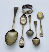 A small collection of hallmarked silver spoons along with a damaged silver napkin ring, total weight