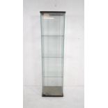 A glass display cabinet, with three shelves - length 42.5cm, depth 36.5cm, height 163.5cm