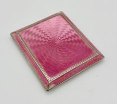 A hallmarked silver cigarette case with pink guilloche enamel decoration- some damage to enamel