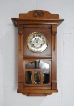 An Edwardian wall clock - height 59cm