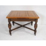 An oak draw leaf dining table along with eight dining chairs, including two carvers - two chairs