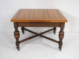 An oak draw leaf dining table along with eight dining chairs, including two carvers - two chairs