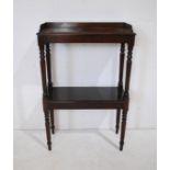 A Victorian mahogany two tier whatnot, with gallery tray, raised on turned legs and supports -