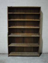 An antique pine freestanding waterfall bookcase - length 121.5cm, depth 31cm, height 187cm