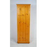 A pine single wardrobe - length 62cm, depth 57cm, height 186cm