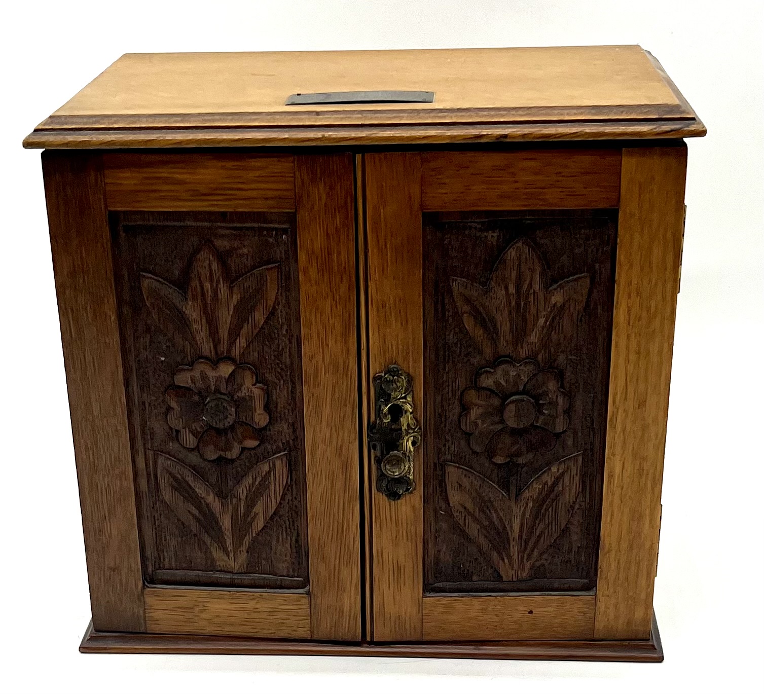 An Edwardian smokers cabinet, dated 1909