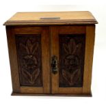 An Edwardian smokers cabinet, dated 1909