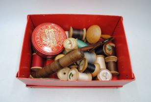 A quantity of vintage wooden cotton reels etc.