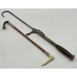 A Victorian brass and wood fish gaff hook plus a SCM mounted hunting crop.