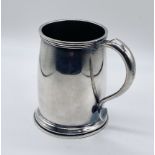 .A hallmarked silver tankard, weight 248.6g