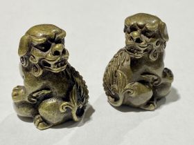 A pair of miniature bronze dogs of Fo