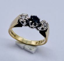 A sapphire and diamond three stone ring set in 9ct gold
