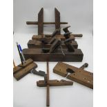 A small quantity of antique wooden woodworking tools, some repurposed and pen holders