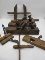 A small quantity of antique wooden woodworking tools, some repurposed and pen holders
