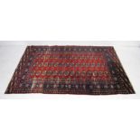 A red ground Eastern rug - some wear - 190cm x 125cm