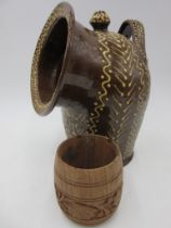 A slipware salt pig with impressed H (possibly John Hudson) along with a carved oak beaker