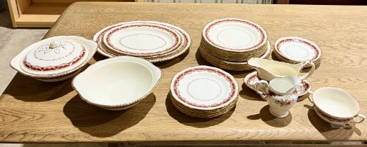 A Ridgway china "Golden Sovereign" part dinner service including dinner plates, terrines, gravy boat