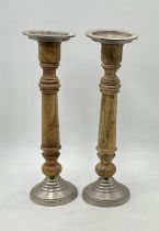 A pair of large candle sticks, height 48cm