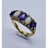 A 9ct gold amethyst and opal 5 stone ring