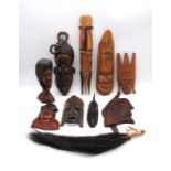 A collection of tribal carvings and masks, including some from Malawi, Ethiopia, Swaziland,