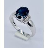 A 9ct white gold sapphire and diamond ring with COA