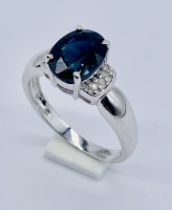 A 9ct white gold sapphire and diamond ring with COA