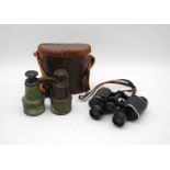 A pair of antique binoculars by Amadio of Throgmorton St, London in leather case along with one
