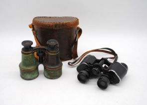A pair of antique binoculars by Amadio of Throgmorton St, London in leather case along with one