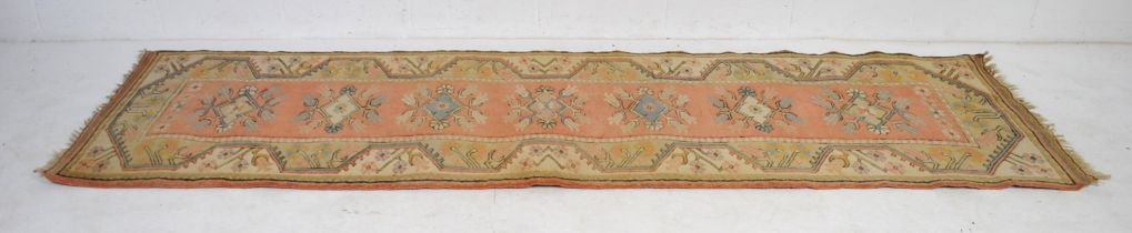 A pink ground Eastern runner - 298cm x 82cm