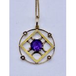 An Art Nouveau pendant set with amethyst and seed pearls on a fine 18ct gold chain (chain weight 1.