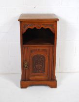 A turn of the century mahogany bedside cabinet, with single drawer and carved detailing - length
