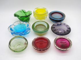 A collection of nine art glass dishes and ash trays, including a Bohemian Czech yellow vase,