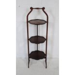 An Edwardian mahogany folding cake stand, A/F